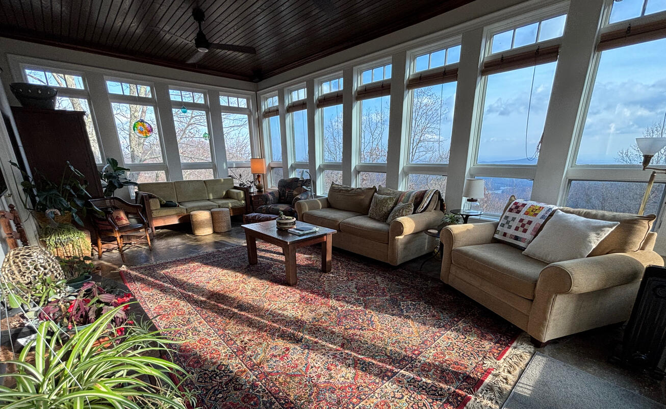 Mission: Warm welcoming family/guest seating in Lg sunroom &amp; I can only utilize homeowners furniture pieces. Homeowners are in love with the space, even when they're not entertaining. What a view too!